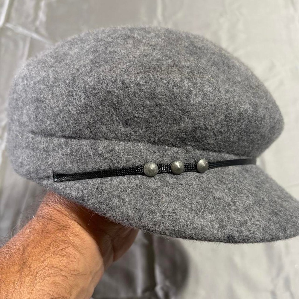Grey wool newsboy cap with‎ black band and silver buttons